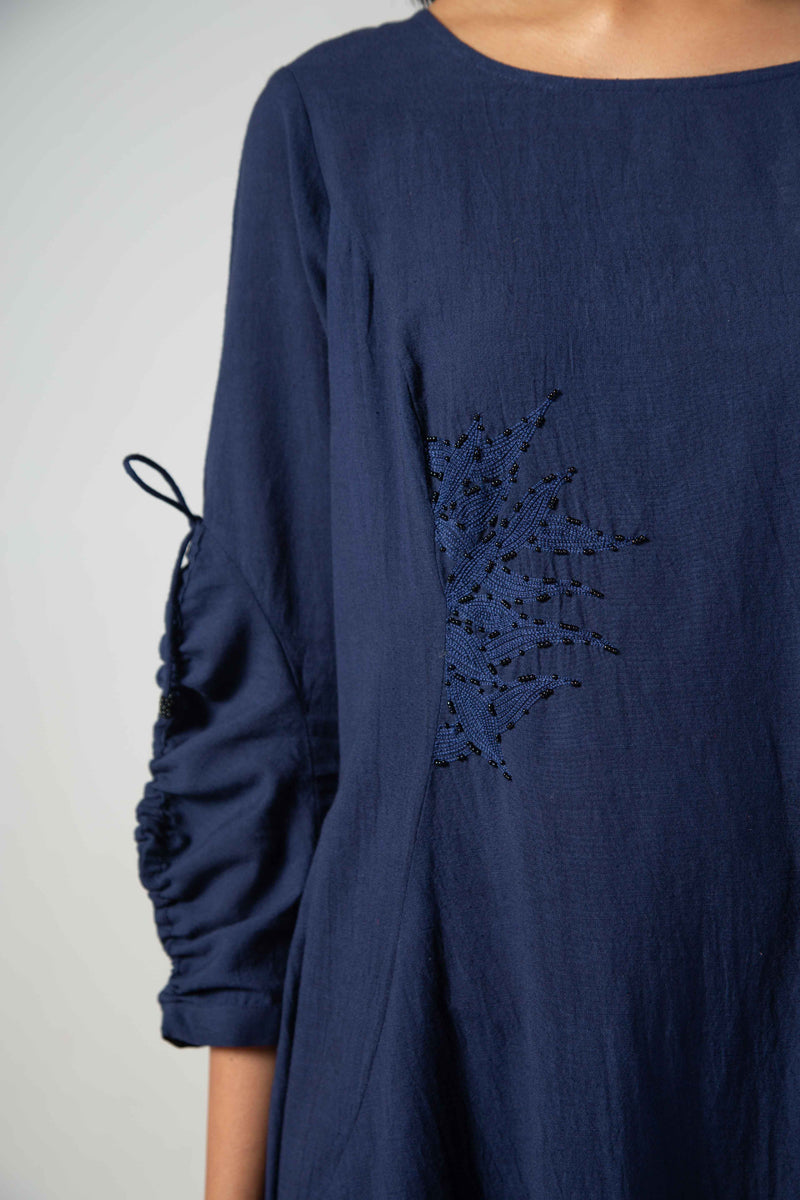 Blue dress with drawstring sleeves