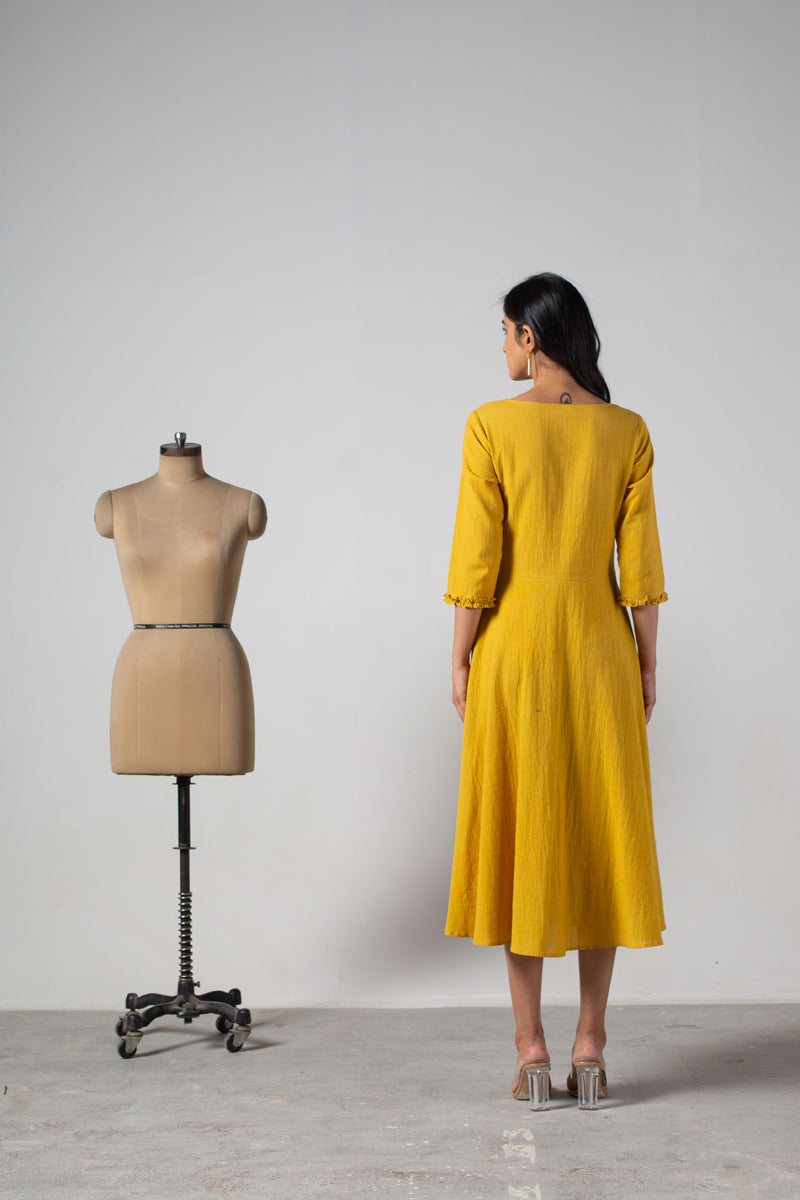 Yellow dress with cut panels