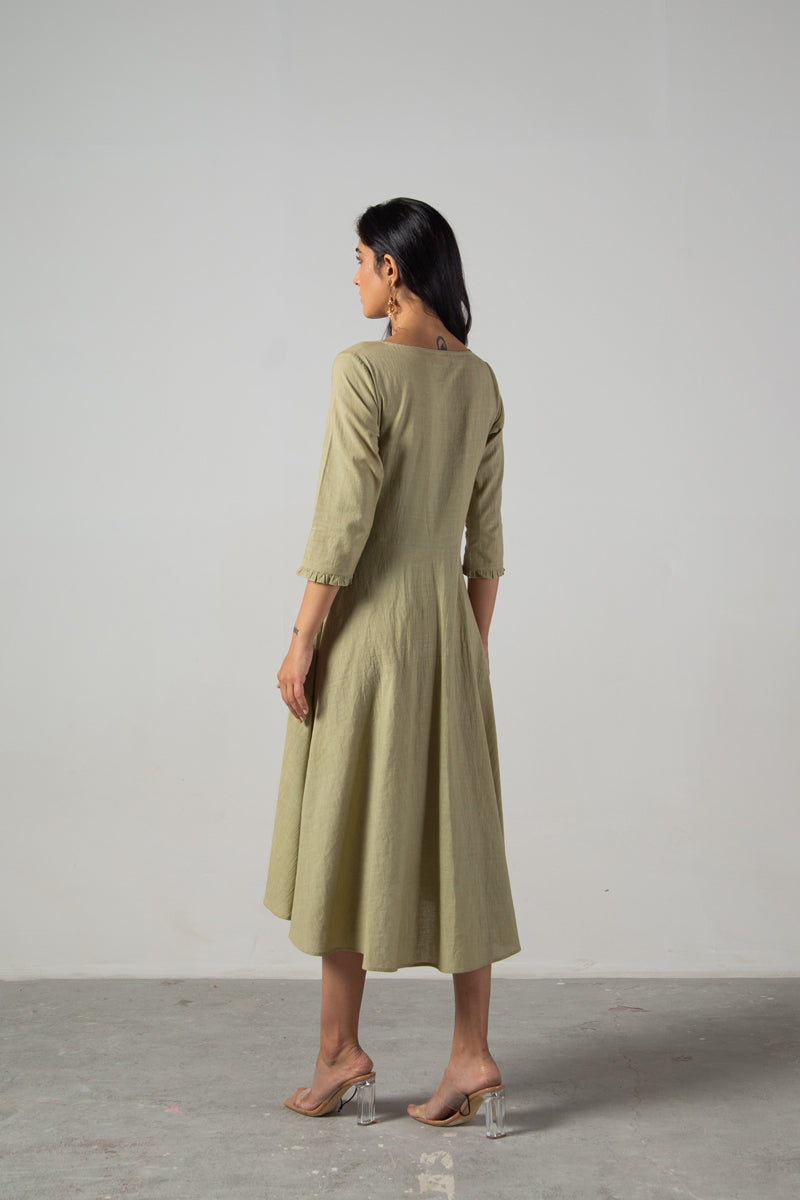 Green dress with cut panels embroidery