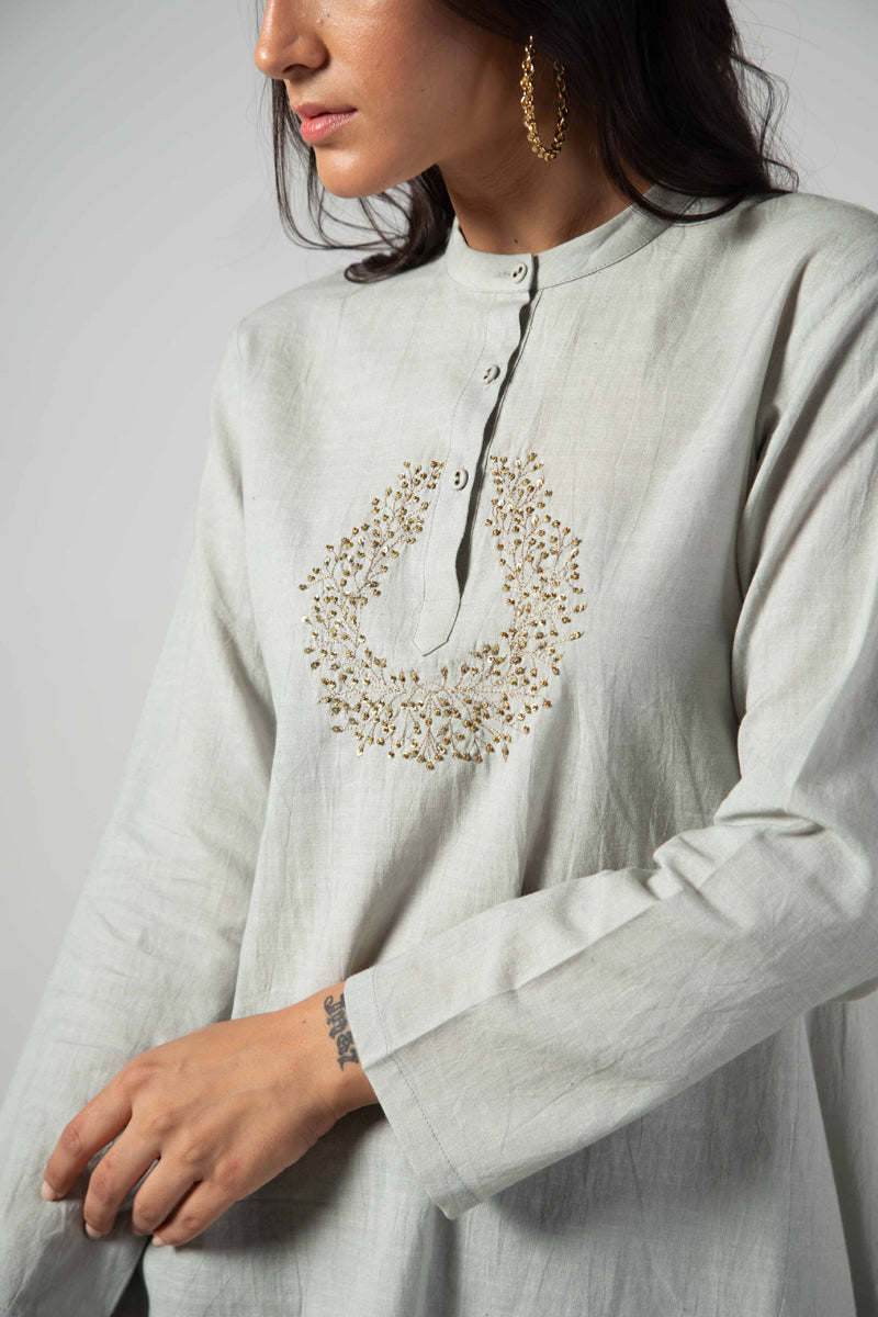 Grey tunic.