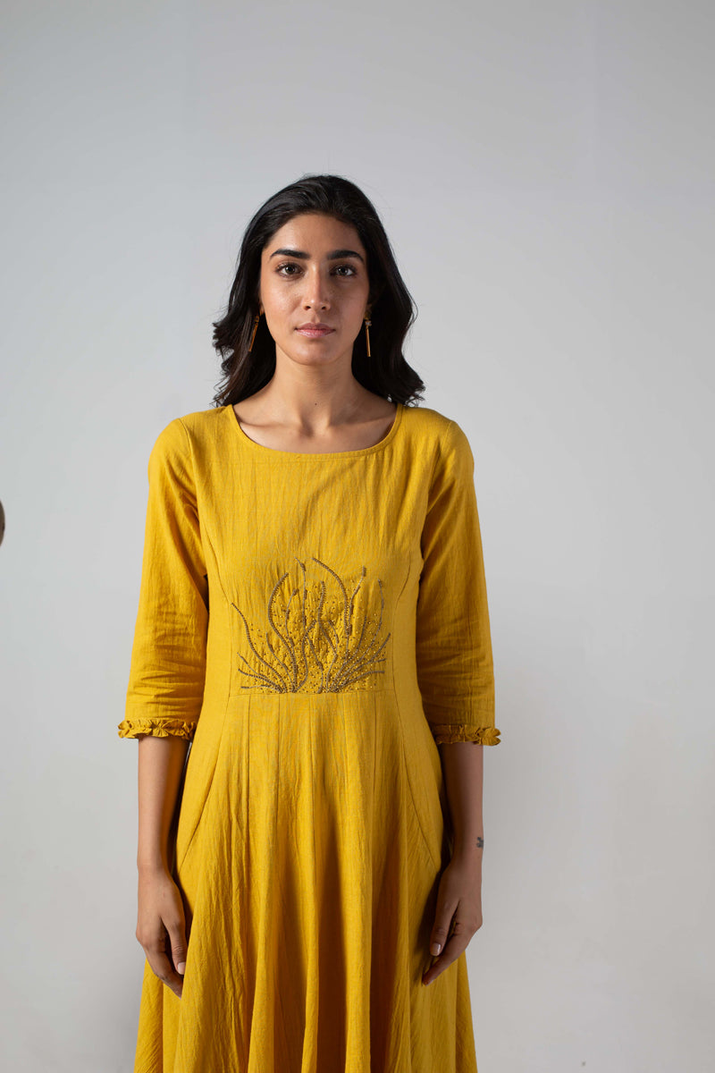 Yellow dress with cut panels