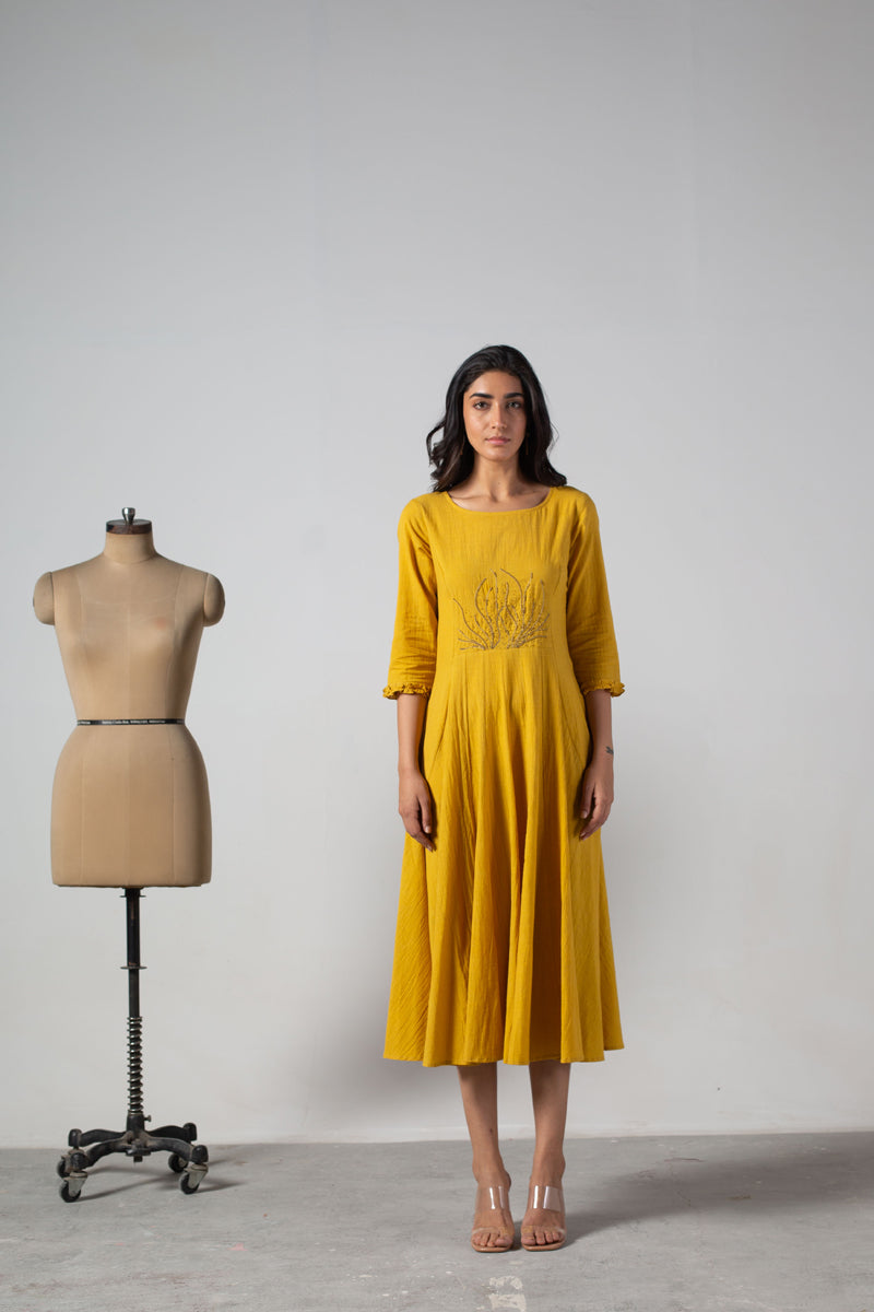 Yellow dress with cut panels