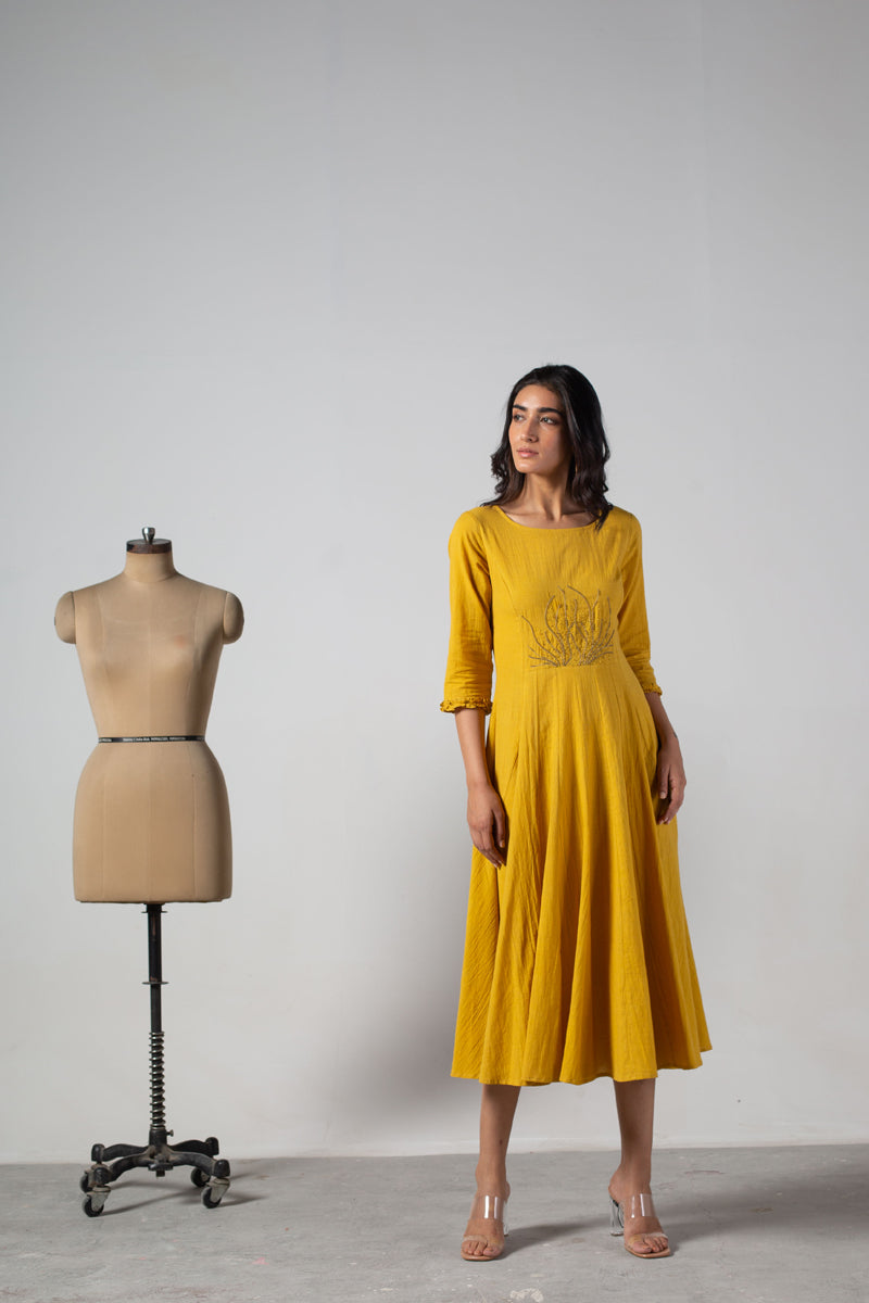 Yellow dress with cut panels