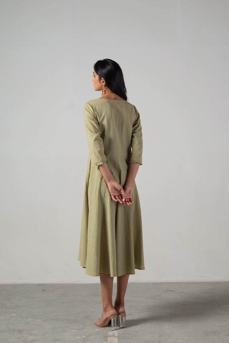 Green dress with cut panels embroidery