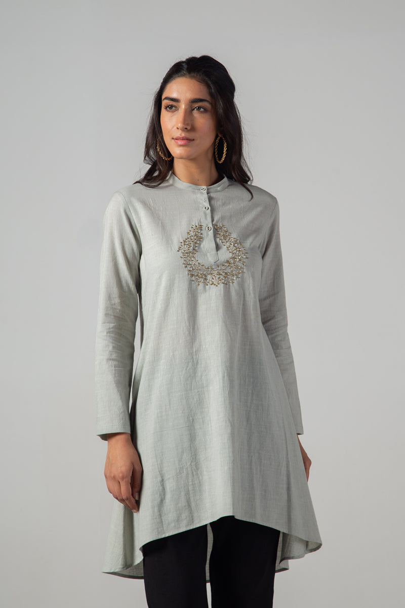 Grey tunic.
