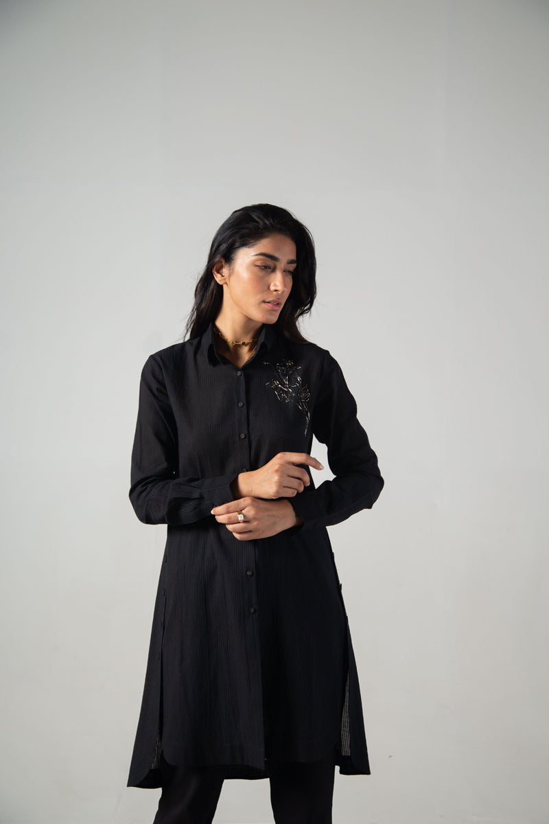 Black long side button shirt with front embroidery